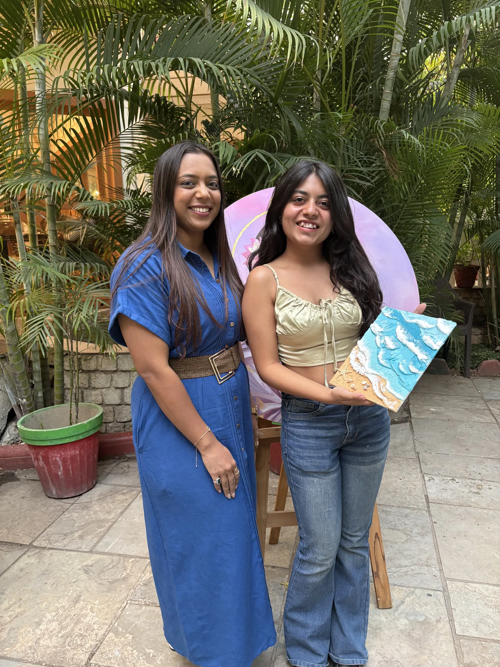 Jahnvi with a participant and her wave canvas